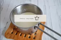 Heat the remaining milk and dissolve the second pa...