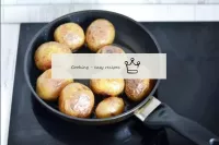 Fry the potatoes over a medium heat, turning the t...