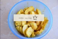 Put all the prepared potatoes in a bowl and mix ev...