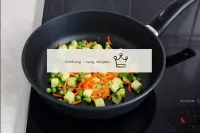 Put the zucchini in the pan, stir. Cook vegetables...
