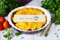 A delicious dish of potatoes and beef is ready. En...