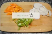 Peel vegetables, cut carrots and peppers into stri...