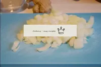 Cut the onions into a cube. In a frying pan, heat ...