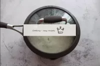 After the specified time, remove the pan of rice f...