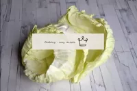Disassemble the cabbage head into leaves. Then boi...