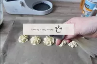 We type dough into a culinary bag. The nozzle is a...