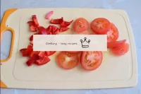 Wash bell peppers and tomatoes. Cut the tomatoes i...