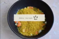 Pour bulgur into the pan, toss with the vegetables...