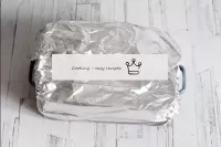 Cover the tin with foil and place in an oven prehe...
