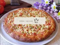 Our pizza is ready. The pizza is very fragrant and...