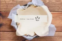 Take a baking dish and cover it with parchment. Pl...