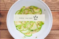 In a deep bowl, mix the fried courgettes, grated c...