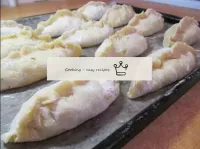 Transfer to a baking tray with baking parchment, g...