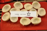 Cut the boiled eggs into two parts and remove the ...