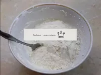 Sift the flour through a sieve and add a little to...