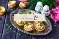 Garnish the ready-made tartlets with fresh herbs a...