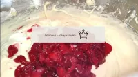 Add crushed cherries to the dough and mix until ho...