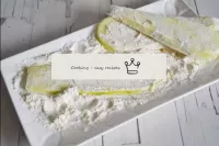 Roll each courgette plate in flour. ...