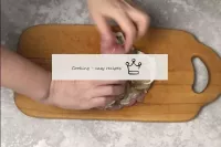 Carefully roll the fillet into a roll, trying to p...