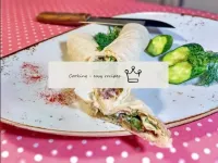 Pita bread roll with canned fish and cucumber...