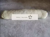 Roll the dough with the filling into a roll, caref...