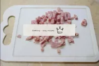 Cut the ham into small cubes and transfer to a sma...