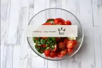 In a salad bowl, combine cherry tomatoes, cucumber...