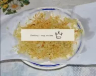 Place the deep-fried potatoes on paper napkins. Wi...