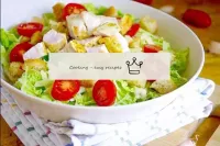 Caesar salad with cheese, tomatoes, chicken and br...