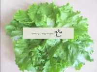 Take a wide, flat dish and lay a base of lettuce l...