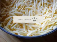 Place a layer of grated cheese in the tin. Lightly...