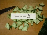 Cut the cucumbers into four along, then cut into t...