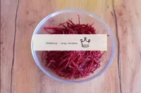 Peel fresh raw beetroot and grate over Korean carr...