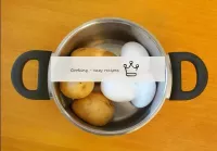 Send the potatoes and eggs to a saucepan, fill wit...