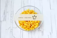 Drain the liquid from the canned corn, dry the gra...