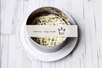 Place a cooking ring (Ø 14 cm) on the plate. Lay o...