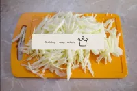 Shave cabbage with a sharp knife. Try to make it a...