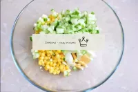 Cut the cucumber into small cubes into a salad bow...