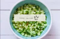 Wash fresh cucumbers, dry. Cut into small cubes, t...