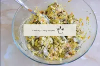 Season the salad with mayonnaise and stir. Transfe...