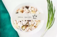 Chicken salad with pineapples and prunes and walnu...