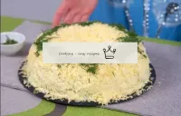 Decorate the salad on top with finely chopped gree...