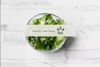 Wash the lettuce leaves, dry and cut into thin str...