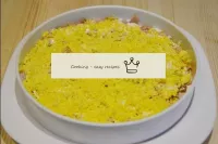 The third layer is yolks grated on a fine grater, ...