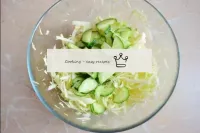 Cut off the ponytails of fresh cucumbers. Cut the ...