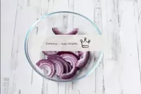 Cut the red onion into half rings. ...