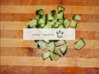 Wash the fresh cucumber and cut it into cubes with...