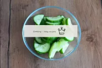 Rinse the cucumber and cut into semicircles. If th...