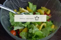 In a salad bowl, combine vegetables and herbs, sal...