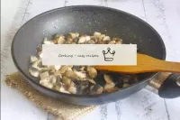 Wash the fresh champignons, cut into strips, trans...